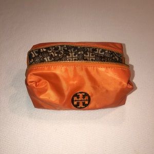 Orange Tory Burch makeup bag